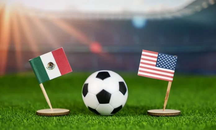 Banderas de México y Estados Unidos en un estadio de fútbol con un pequeño balón.